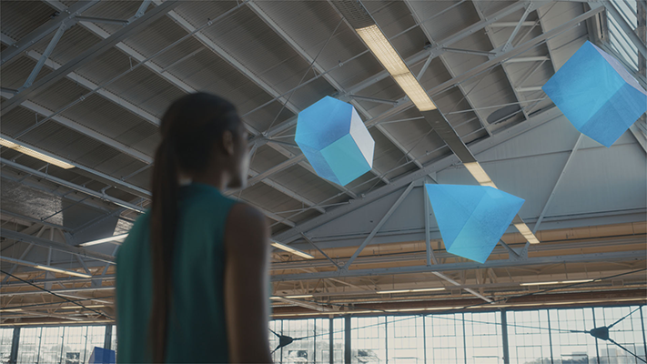 Research prototype scene showing spatial blue interface elements in a physical room.